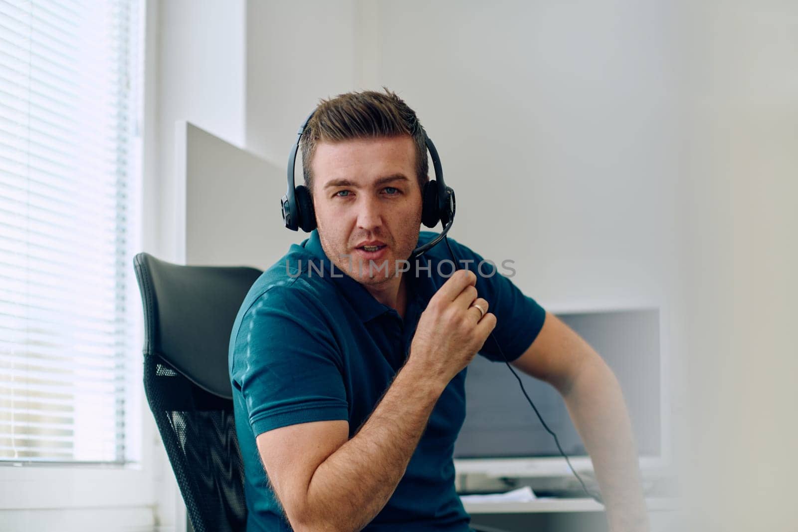 Close Up Portrait of a Customer Support Representative in a Call Center Environment. by dotshock