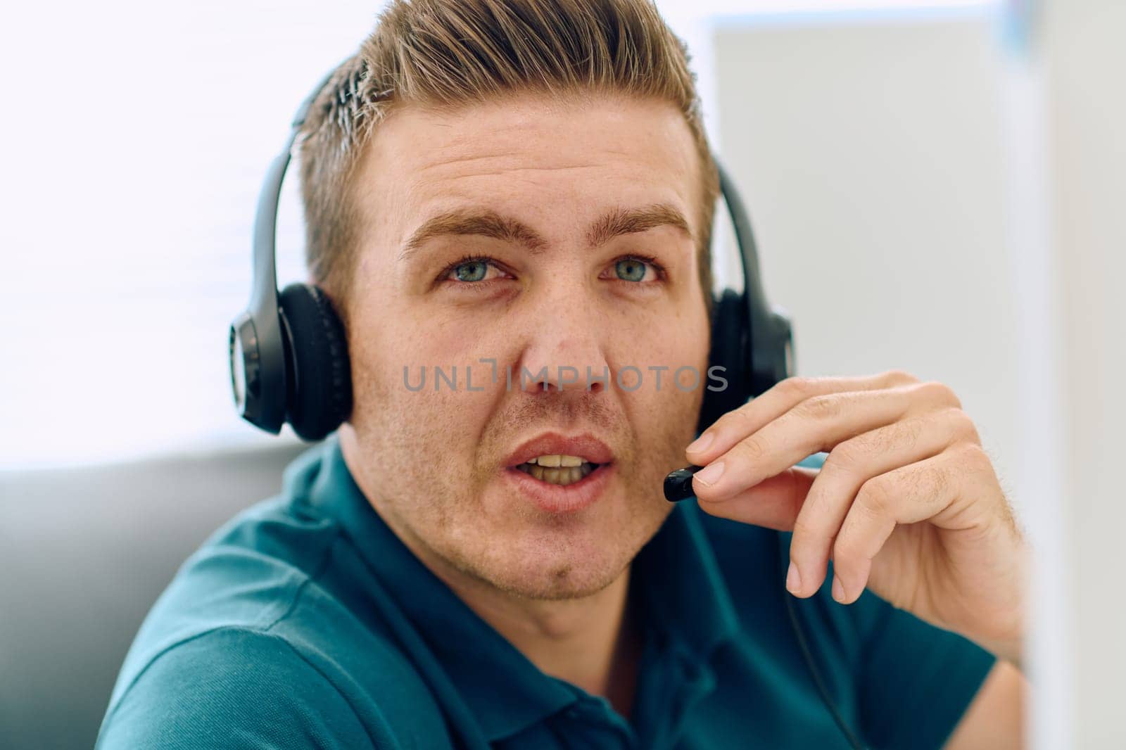 Close Up Portrait of a Customer Support Representative in a Call Center Environment. by dotshock