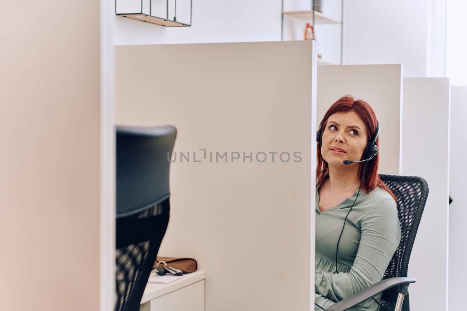 Female Call Center Agent Providing Customer Support and Assistance. by dotshock