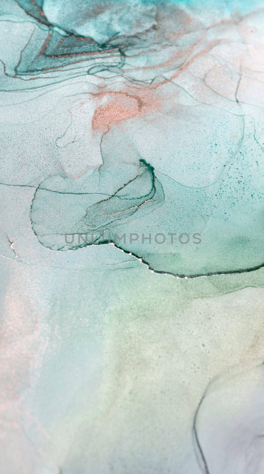 A close-up of abstract ink swirls in shades of aqua, blue, and rose. The ink has been carefully blended to create a unique and beautiful pattern.