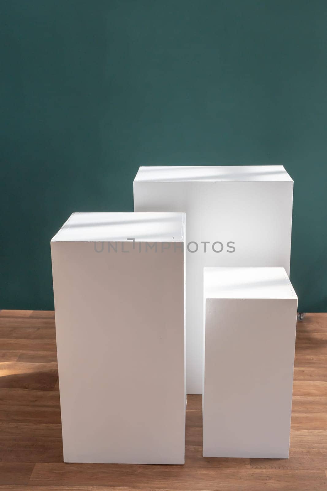 Product photography mockup. White bases against green background. High quality photo