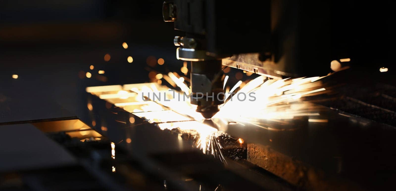 Laser cutting of metal in modern industrial technologies. Industrial processing concept