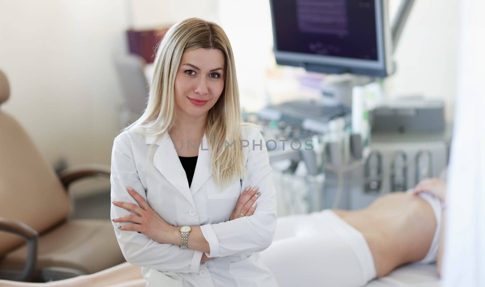 Portrait of doctor of ultrasound diagnostics on background of patient. Ultrasound diagnosis of pregnancy concept