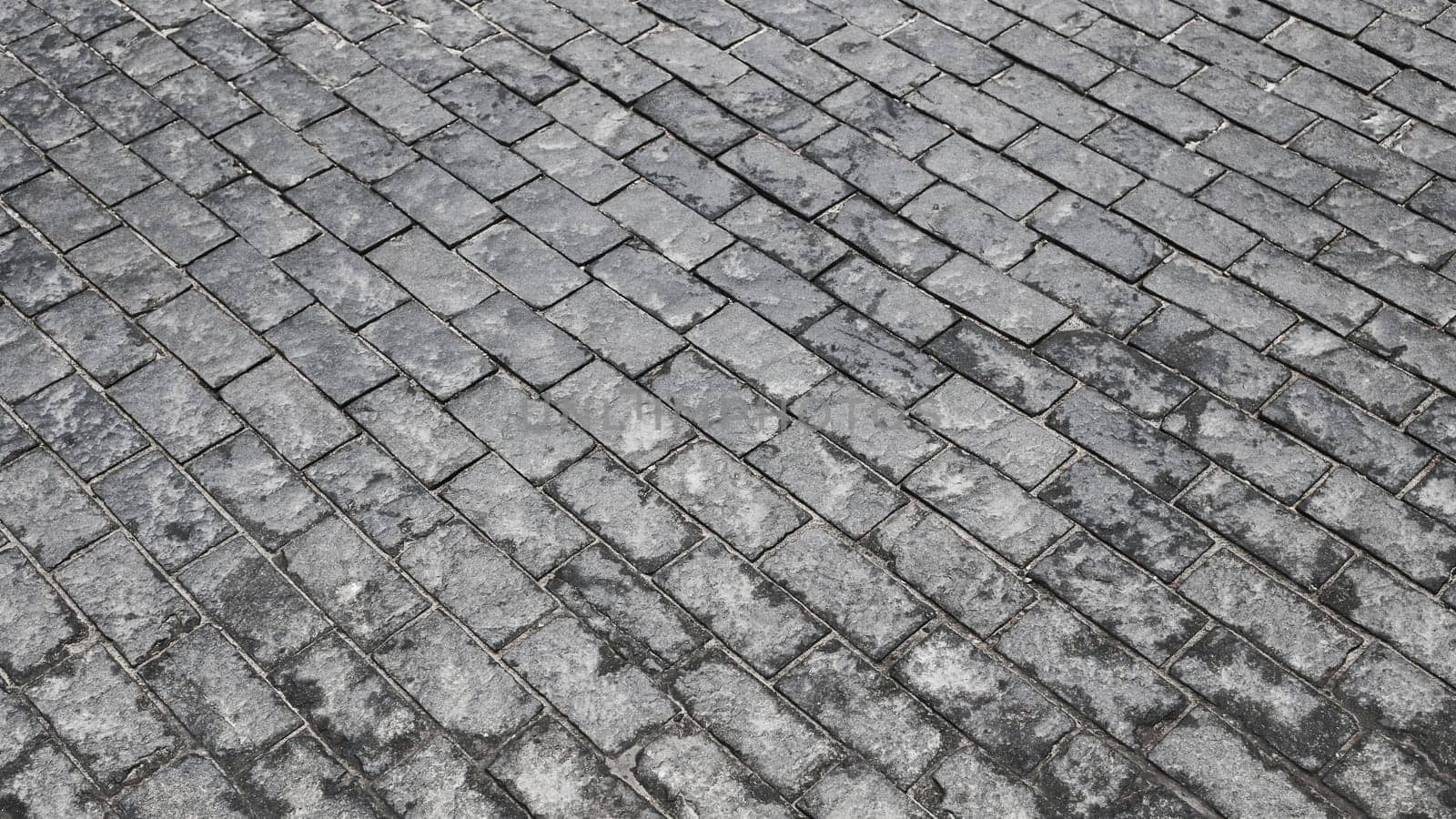 Cobblestone pave top view of old stony sidewalk close up by gelog67