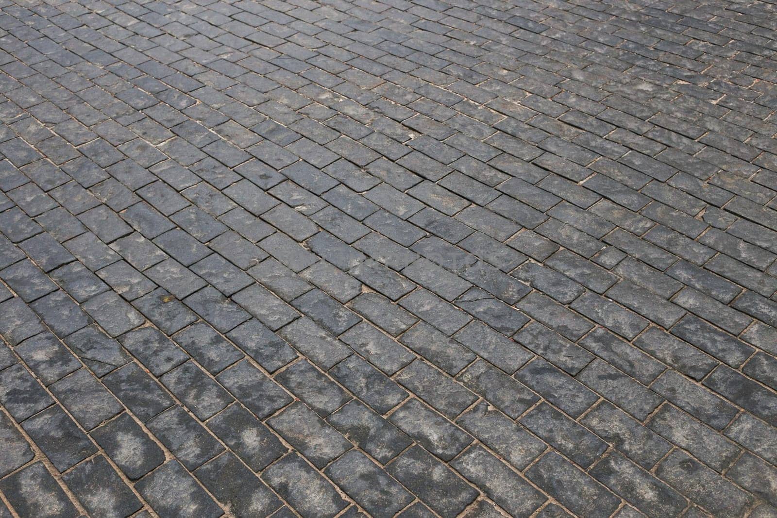 Old cobblestone street, cobblestones, tiled floor, pavement texture.