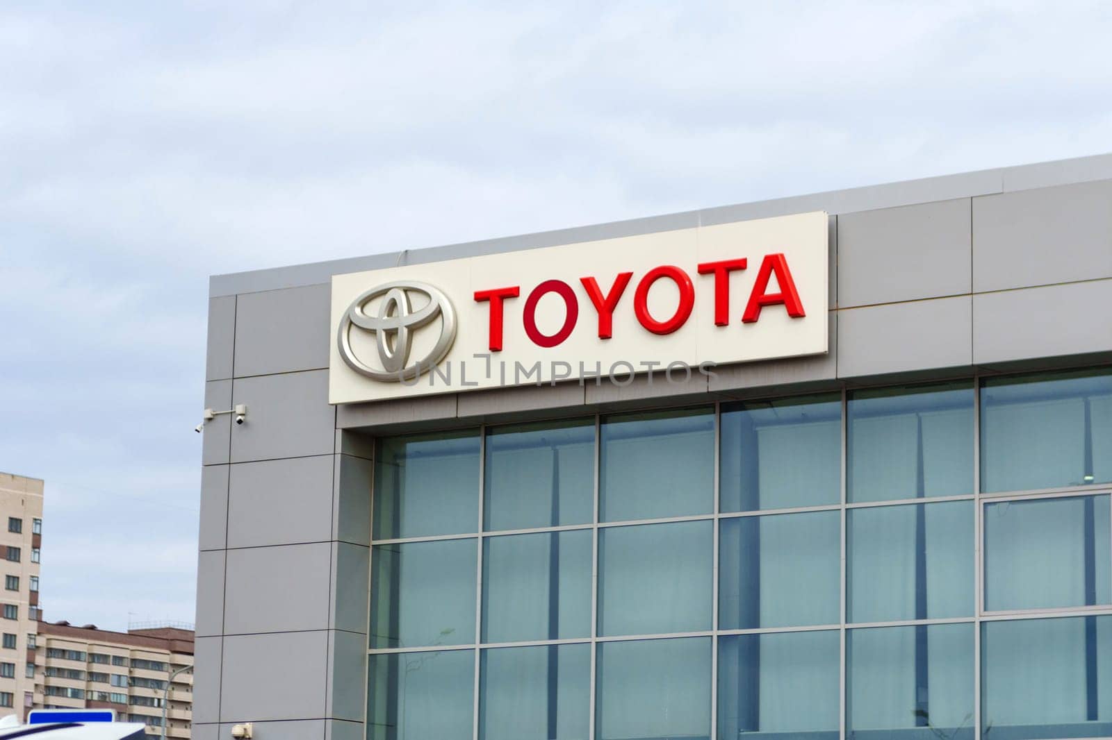 Tyumen, Russia-March 02, 2024: Toyota logo Sign Against Blue Sky. Selective focus