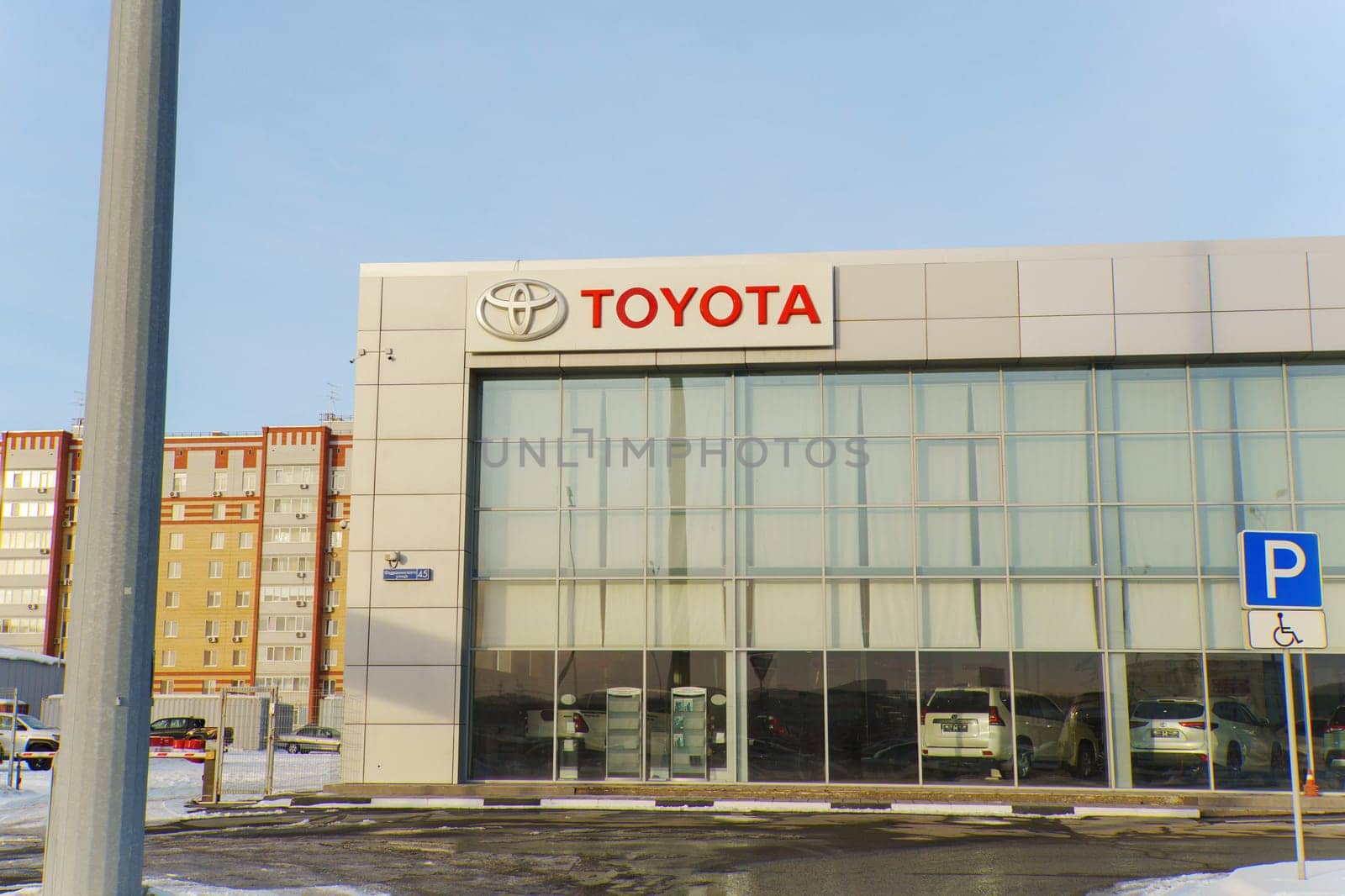 Tyumen, Russia-March 02, 2024: Toyota logo Sign Against Blue Sky. Selective focus