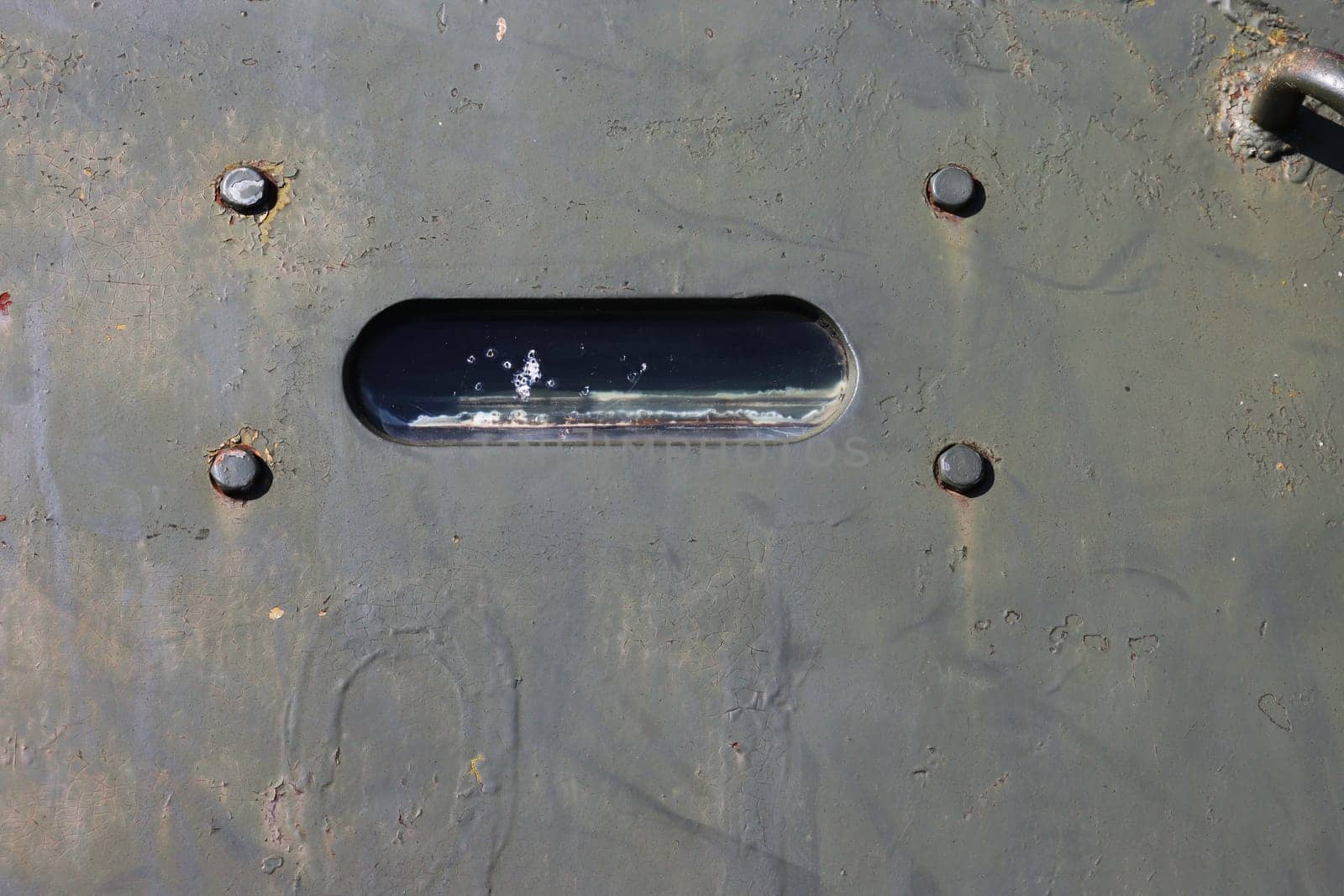 Viewing window of an armored car close-up. by gelog67