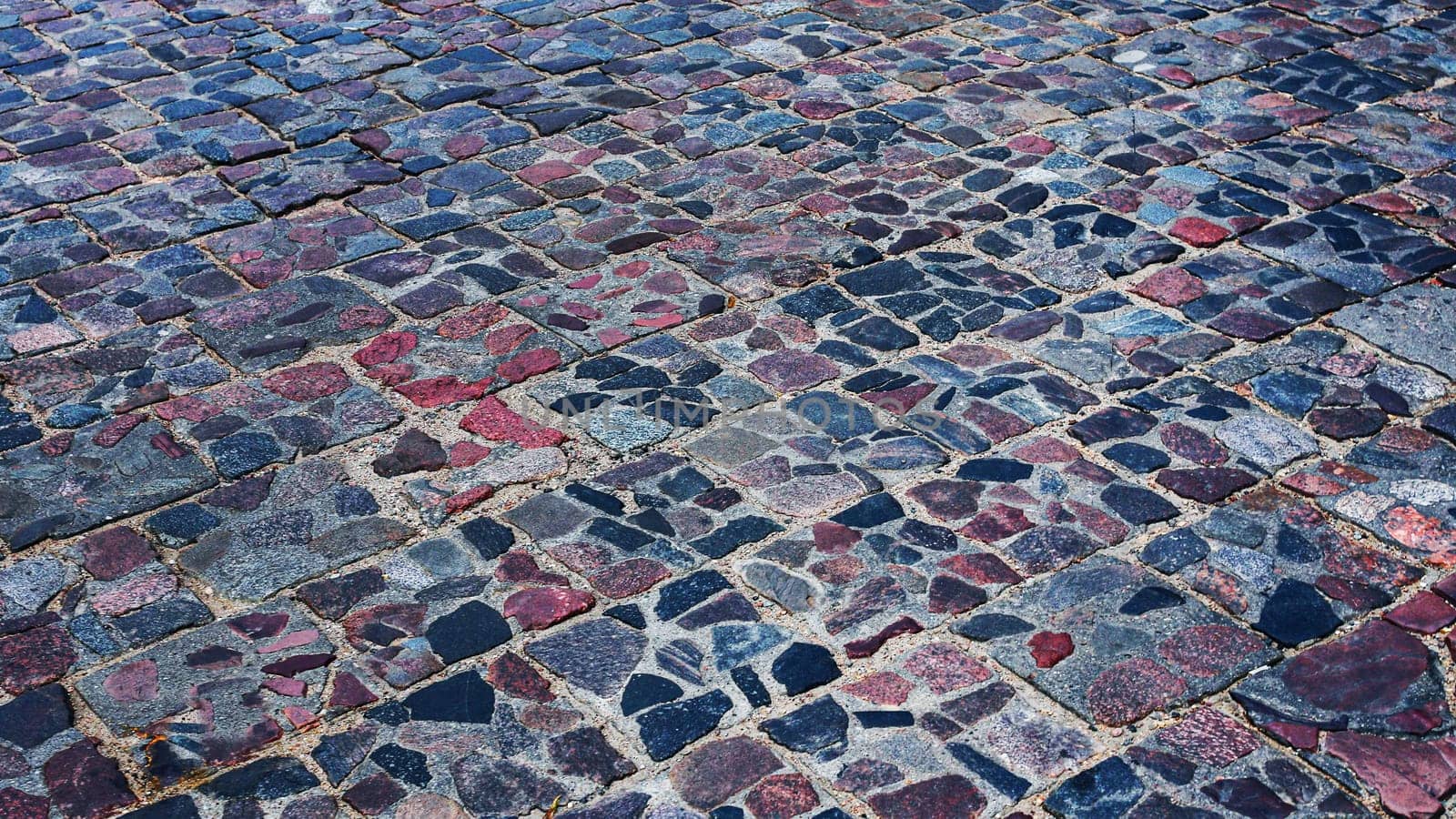 Motley, multi-colored paving stones, view at 45 degrees. by gelog67