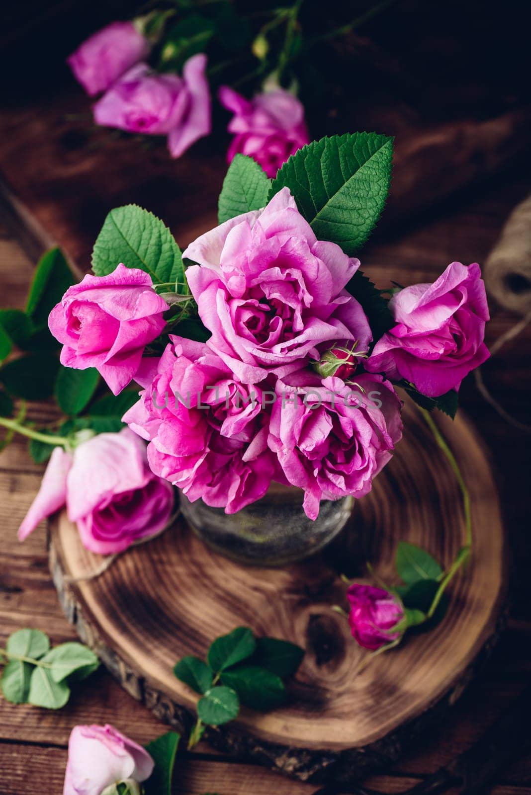 Pink garden roses in glass vase by Seva_blsv
