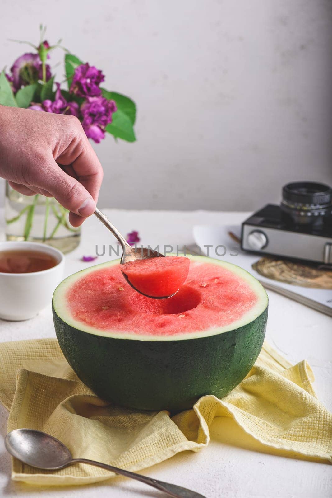 The Spoon with Piece of Watermelon in Man Hand