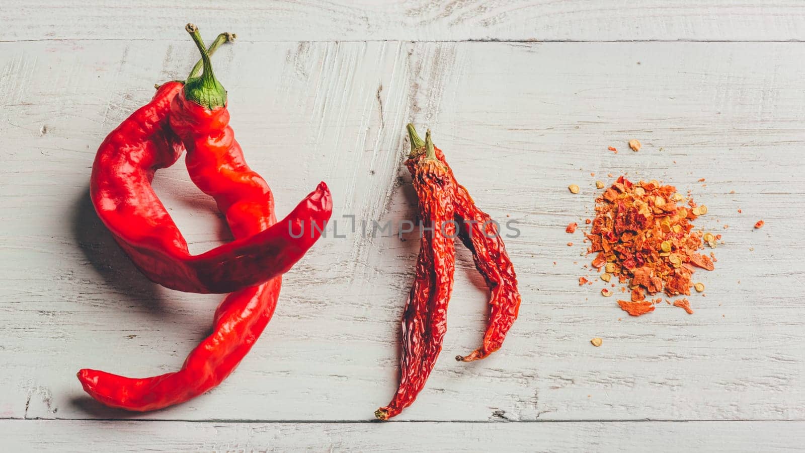 Fresh, dried and crushed red chili pepper by Seva_blsv