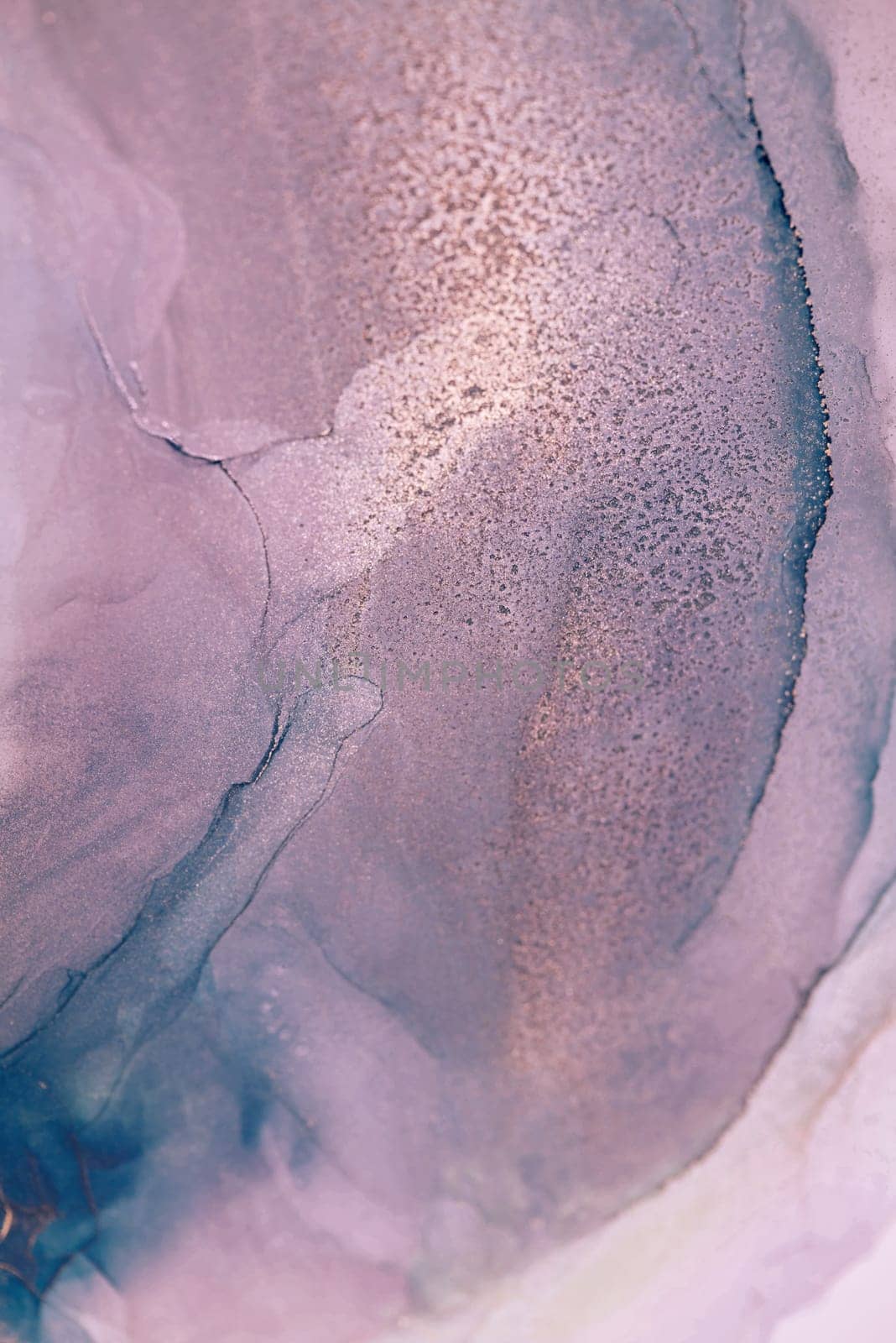 A close-up image of abstract ink swirls in shades of lavender and teal, creating a mesmerizing and artistic effect.