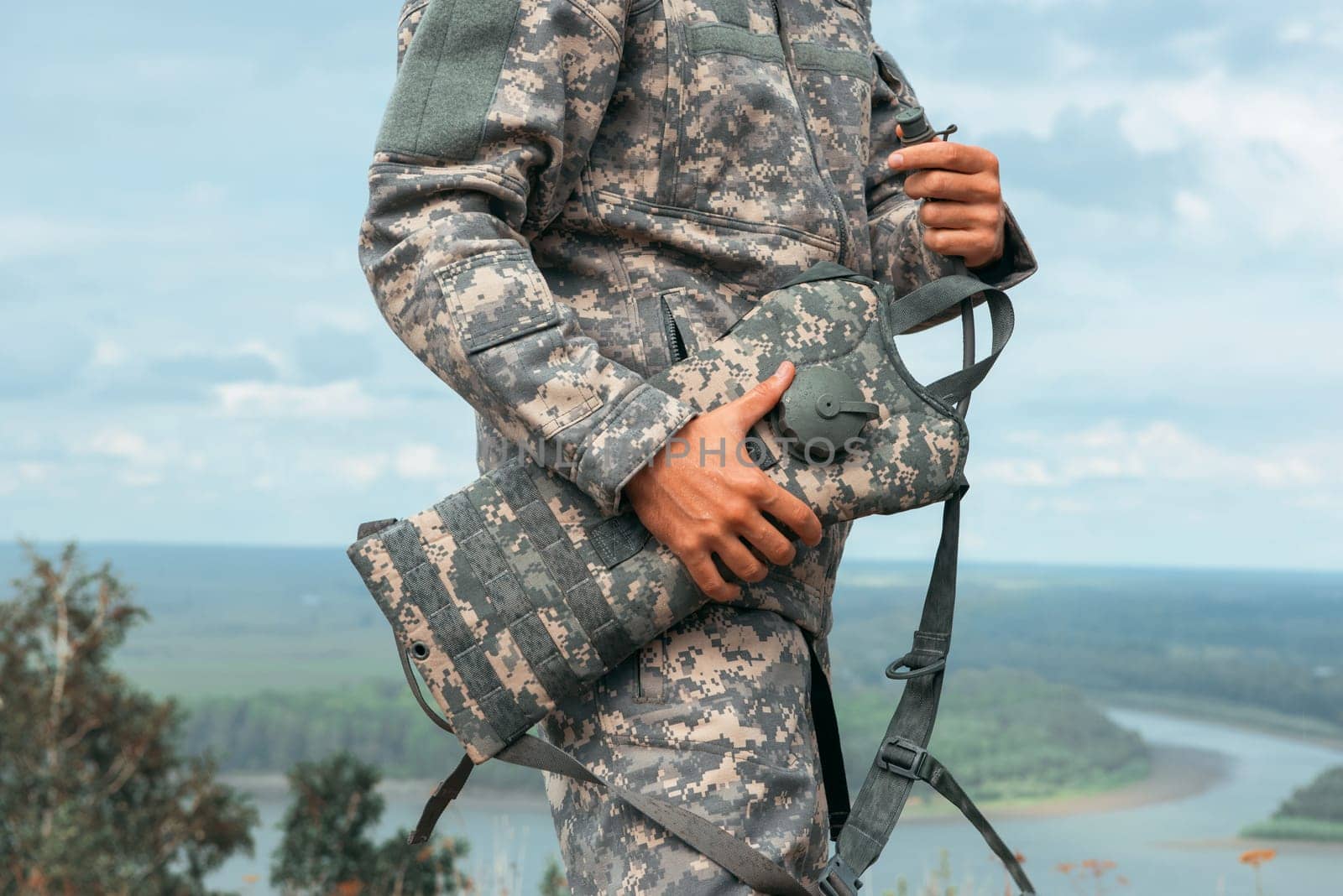 Man tourist standing in military outfit outdoor. Travel or military concept