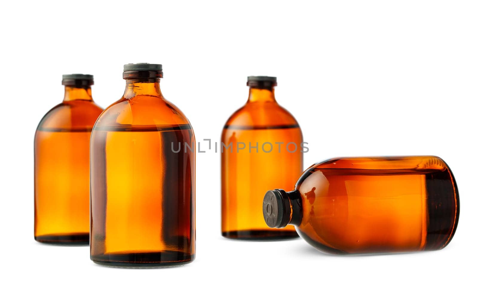 Four amber glass bottles with black screw caps stand in a row on a white background.