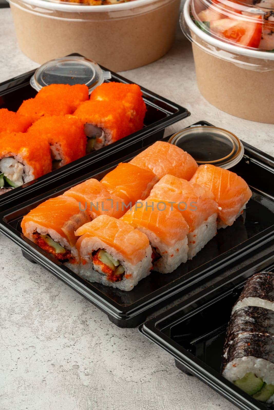 Close up photo of sushi rolls on gray table