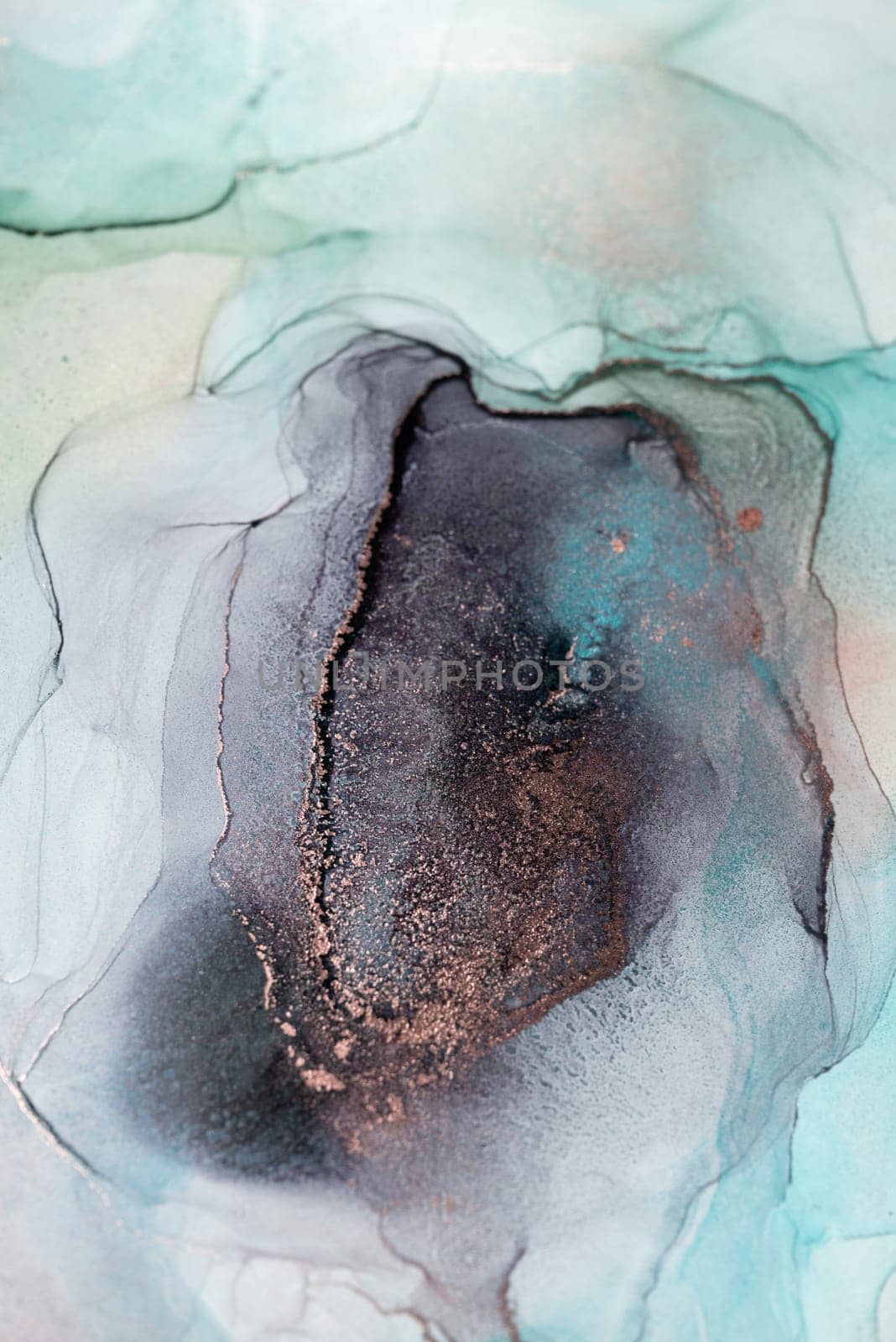 A close-up shot of an abstract art piece created with ink. The swirling patterns feature a teal, gray, and black color scheme.