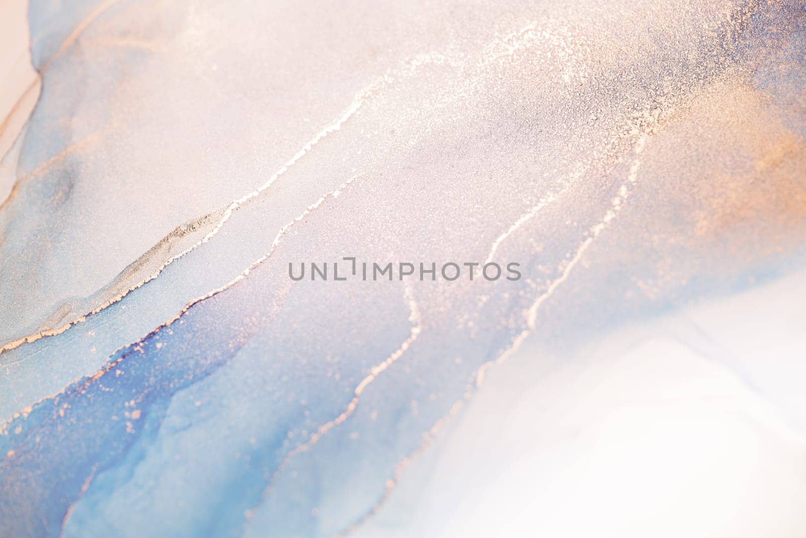 An abstract painting featuring swirls of blue, pink, and white ink with delicate gold accents.