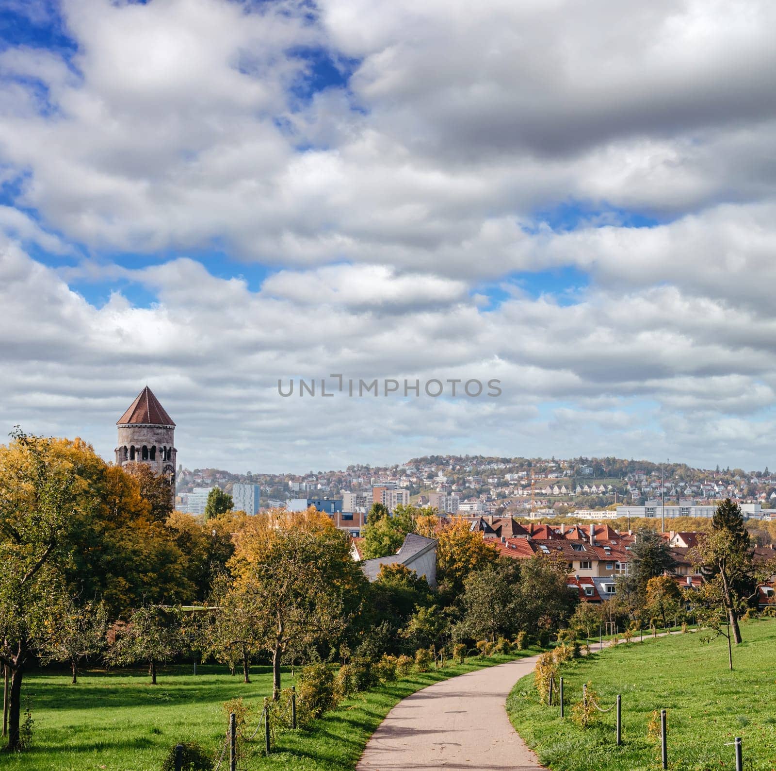 Germany, Stuttgart panorama view. Beautiful houses in autumn, Sky and nature landscape. Vineyards in Stuttgart - colorful wine growing region in the south of Germany with view over Neckar Valley. Germany, Stuttgart city panorama view above vineyards, industry, houses, streets, stadium and highway at sunset in warm orange light.