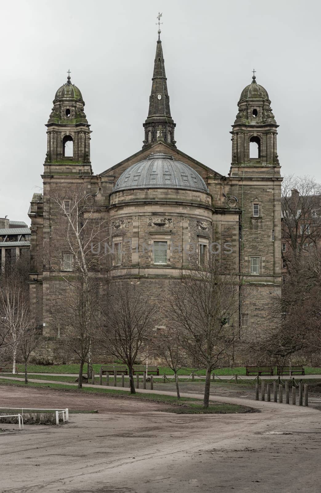 Edinburgh, Scotland - Jan 16, 2024 - Exterior view of The ancient Parish Church of St Cuthbert is situated within a large churchyard that bounds Princes Street Gardens in the centre of Edinburgh. Space for text, Selective focus.
