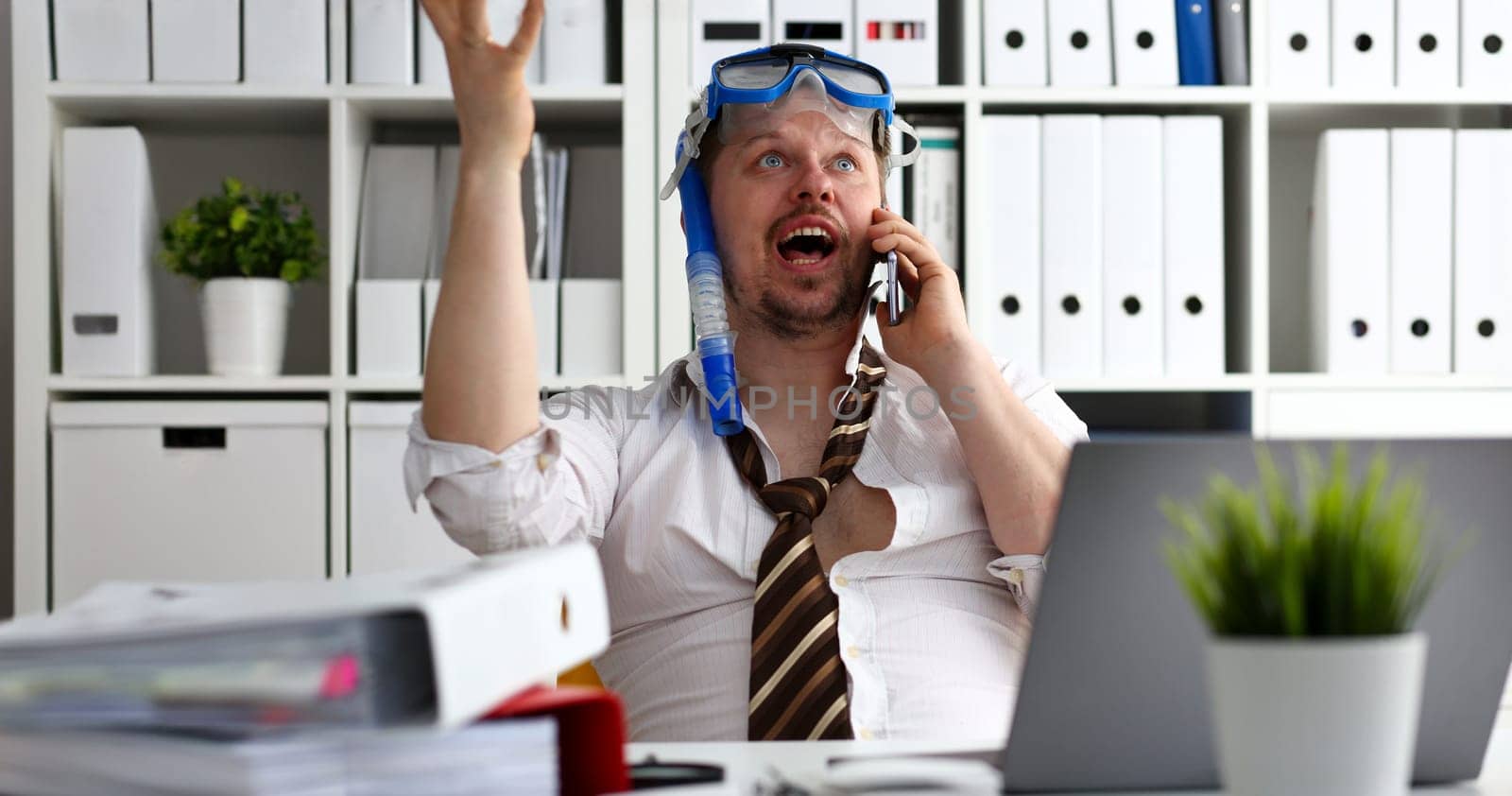 Man wearing suit and tie in goggles and snorkel talk cellphone at office workplace ready to take off portrait. Count days to leave annual day off workaholic freedom fun tourism resort idea concept