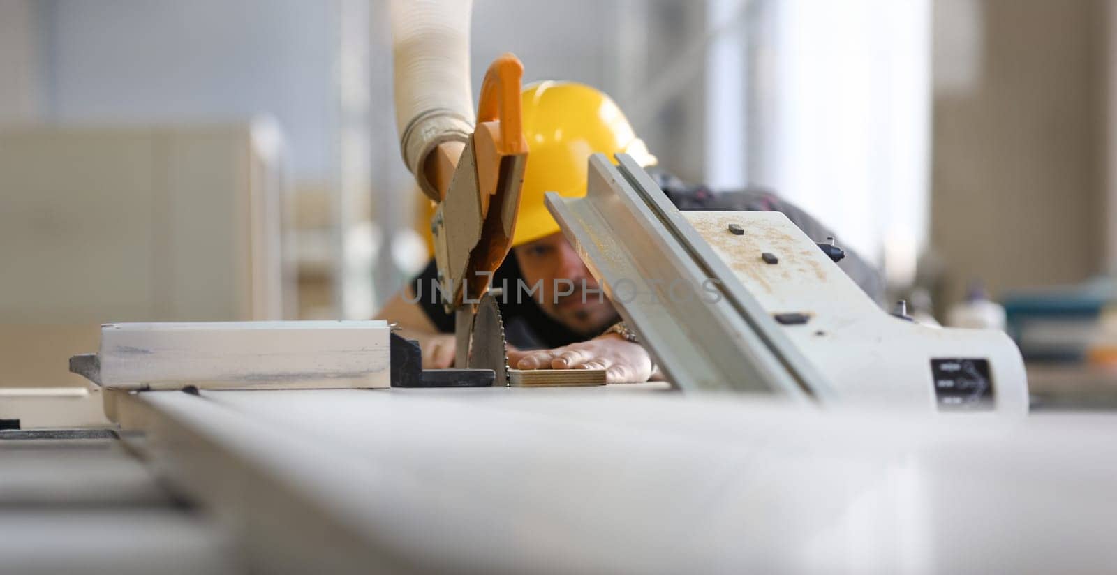 Worker using electric saw portrait. Manual job workplace DIY inspiration improvement fix shop yellow helmet hard hat joinery startup idea industrial education profession career concept