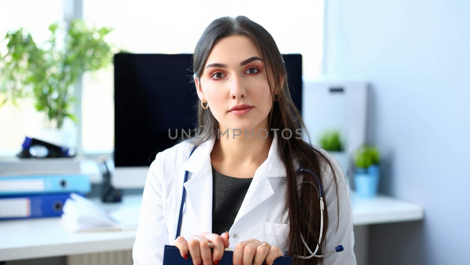 Beautiful smiling female doctor at workplace portrait. Physical and disease prevention patient aid exam visit 911 ward round prescribe remedy healthy lifestyle consultant profession concept