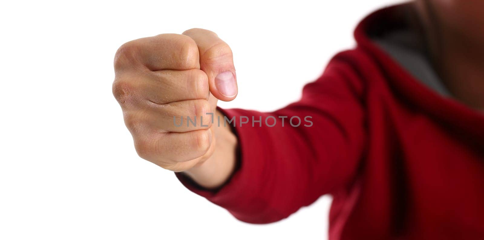 Male clenched fist isolated on white background closeup. Aggressive angry strong riot for freedom victory concept