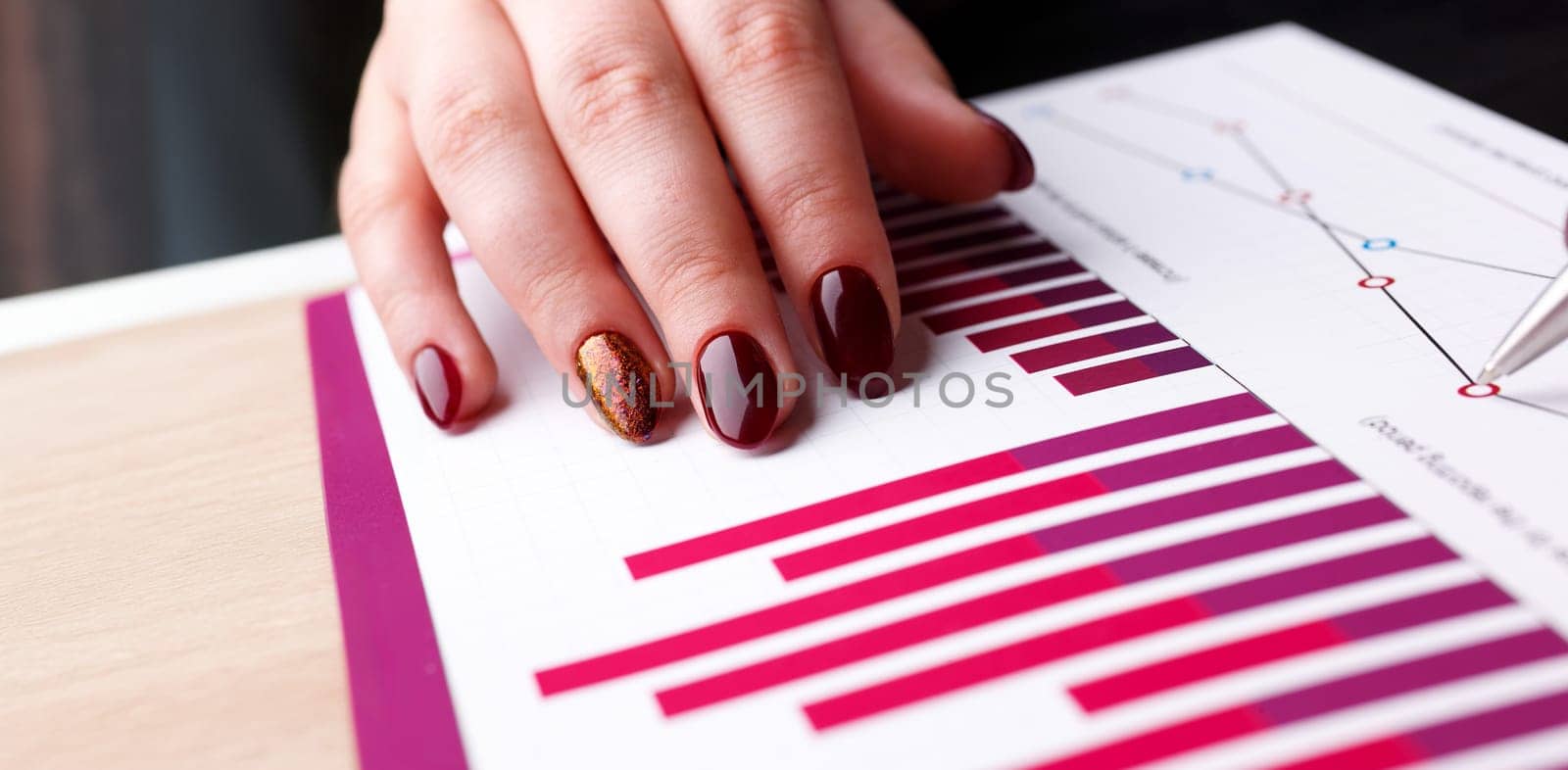 Female arm hold and point silver pen in financial graph solve and discuss problem closeup. Fresh view at situation board council sale adviser examine advisor profit audit job market irs inspector