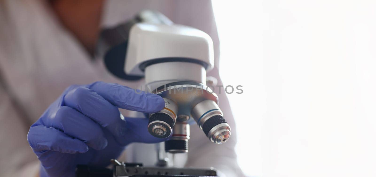 The head microscope on the background laboratory is a study human biology analyzes for non-compliance with the requirements organization public health at international level