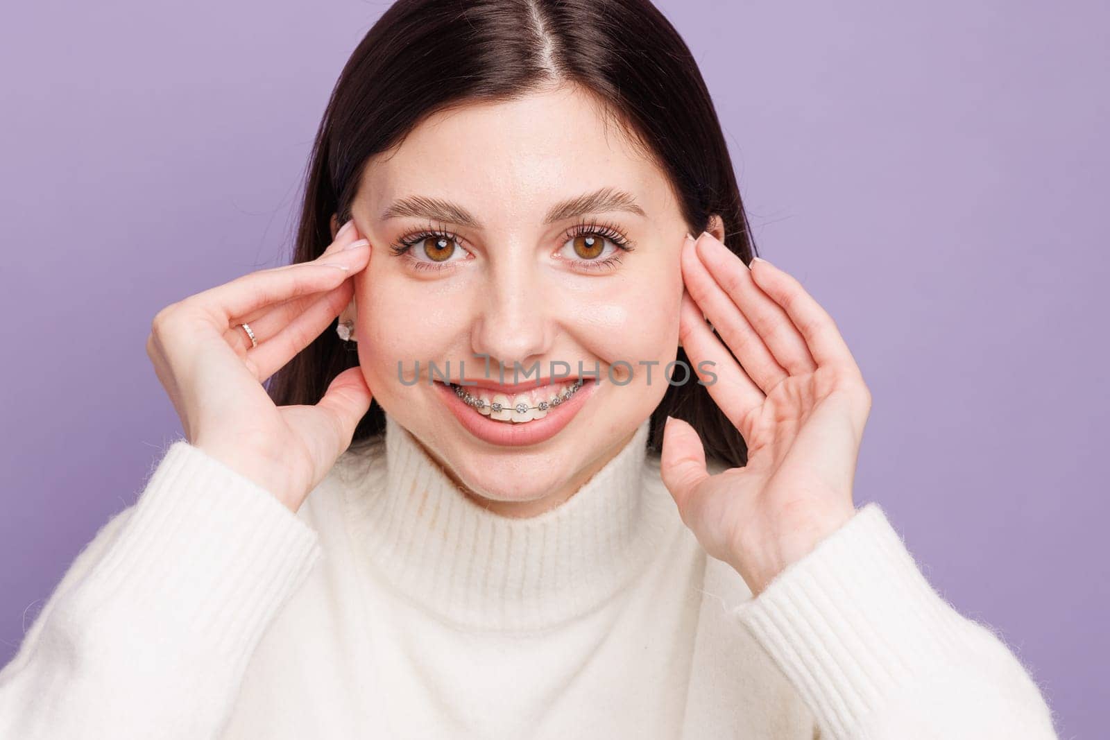 portrait of a girl with braces close-up, woman is happy with braces, beautiful teeth concept