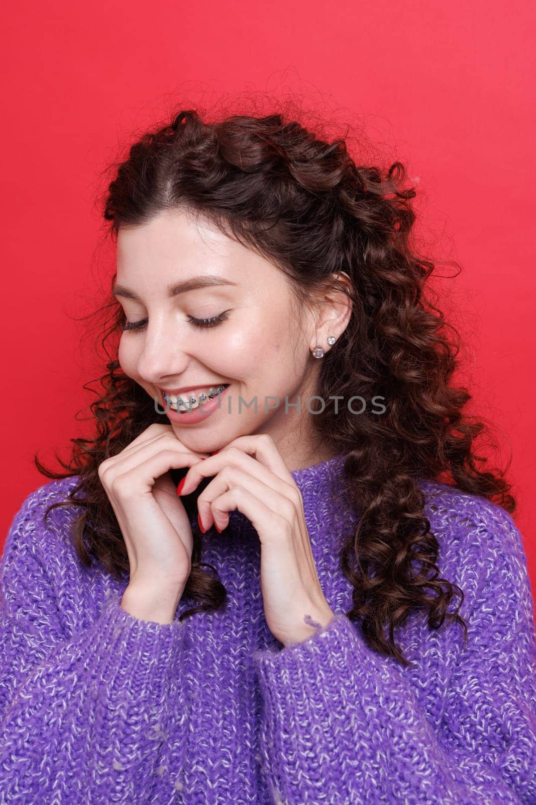 portrait of a girl with braces close-up, woman is happy with braces, beautiful teeth concept