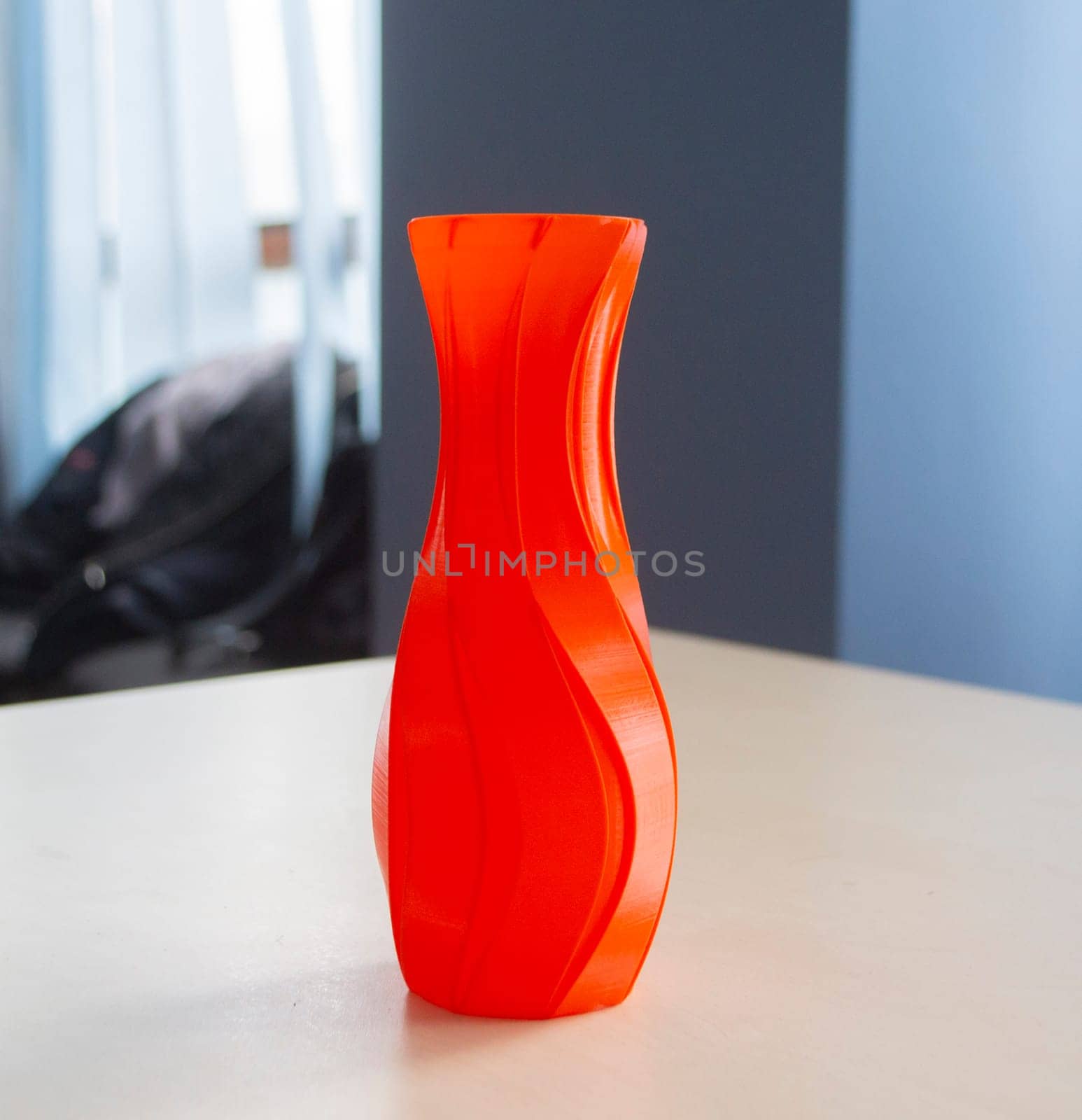 Object form vase of red color printed on a 3D printer. Three-dimensional model by Mari1408