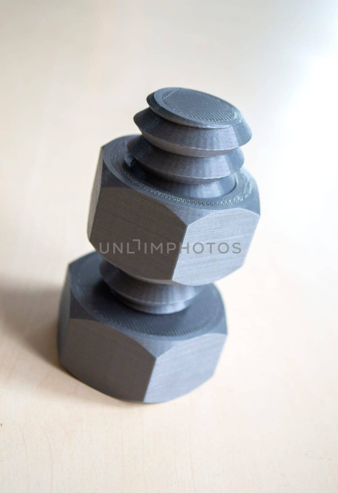Object in form of washer and bolt of gray color printed on 3D printer by Mari1408