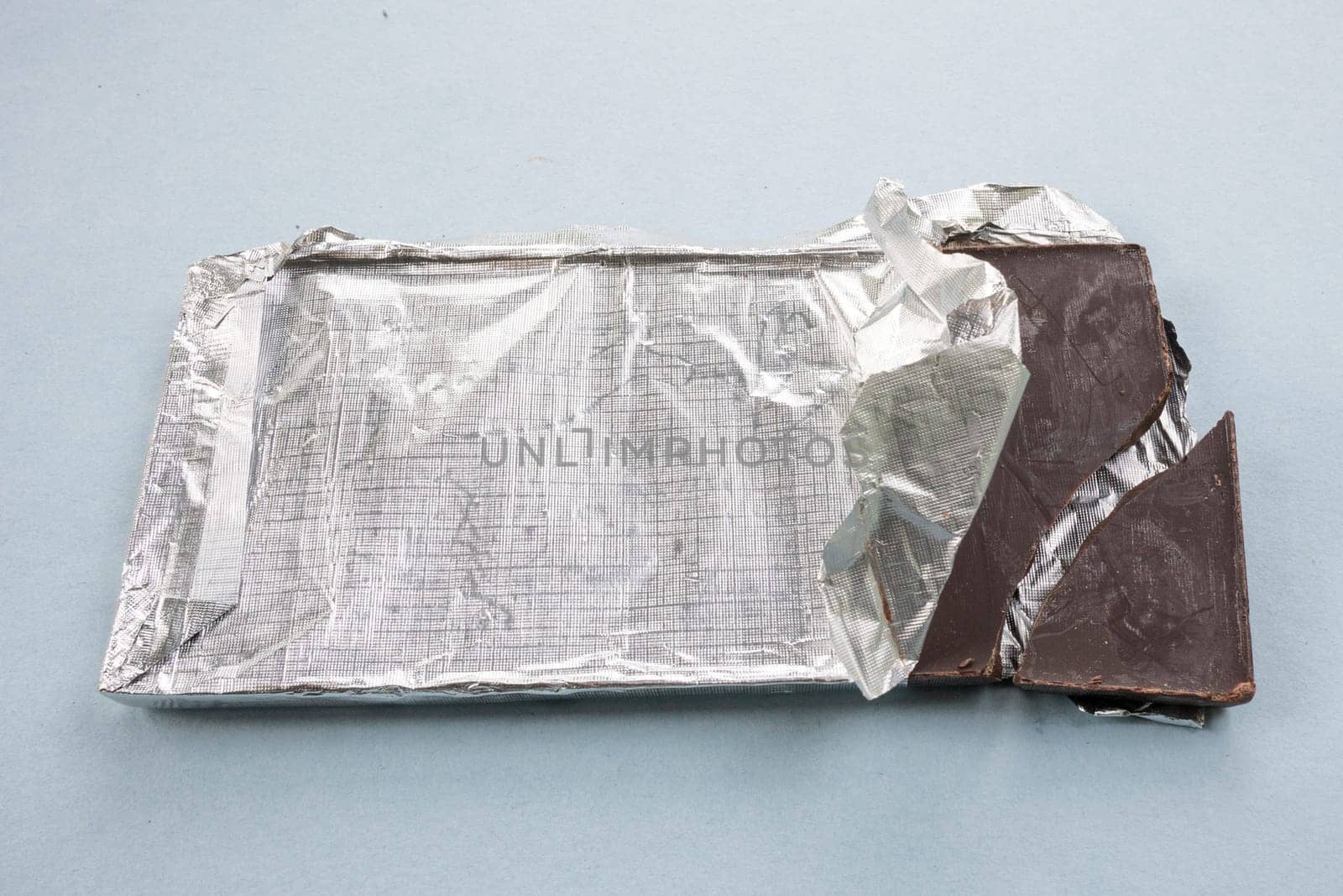 Chocolate bar in foil close-up. by gelog67