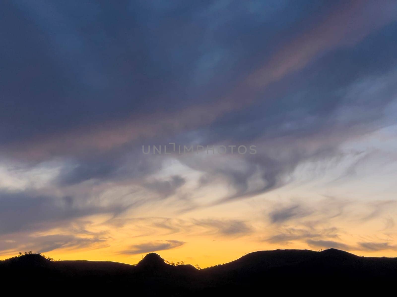 Stunning sunset paints the sky in vibrant hues over Alpana Station in the Flinders Ranges landscape.