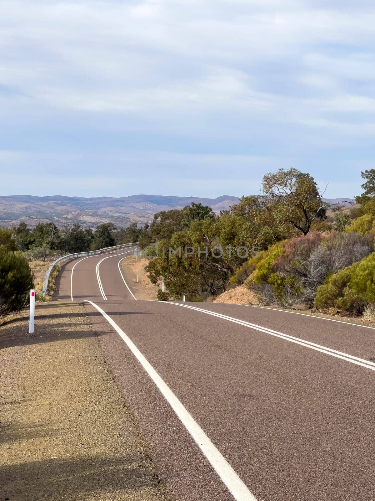 Flinders Ranges Way stretches through the picturesque Ikara-Flinders Ranges, offering breathtaking views of the rugged terrain.