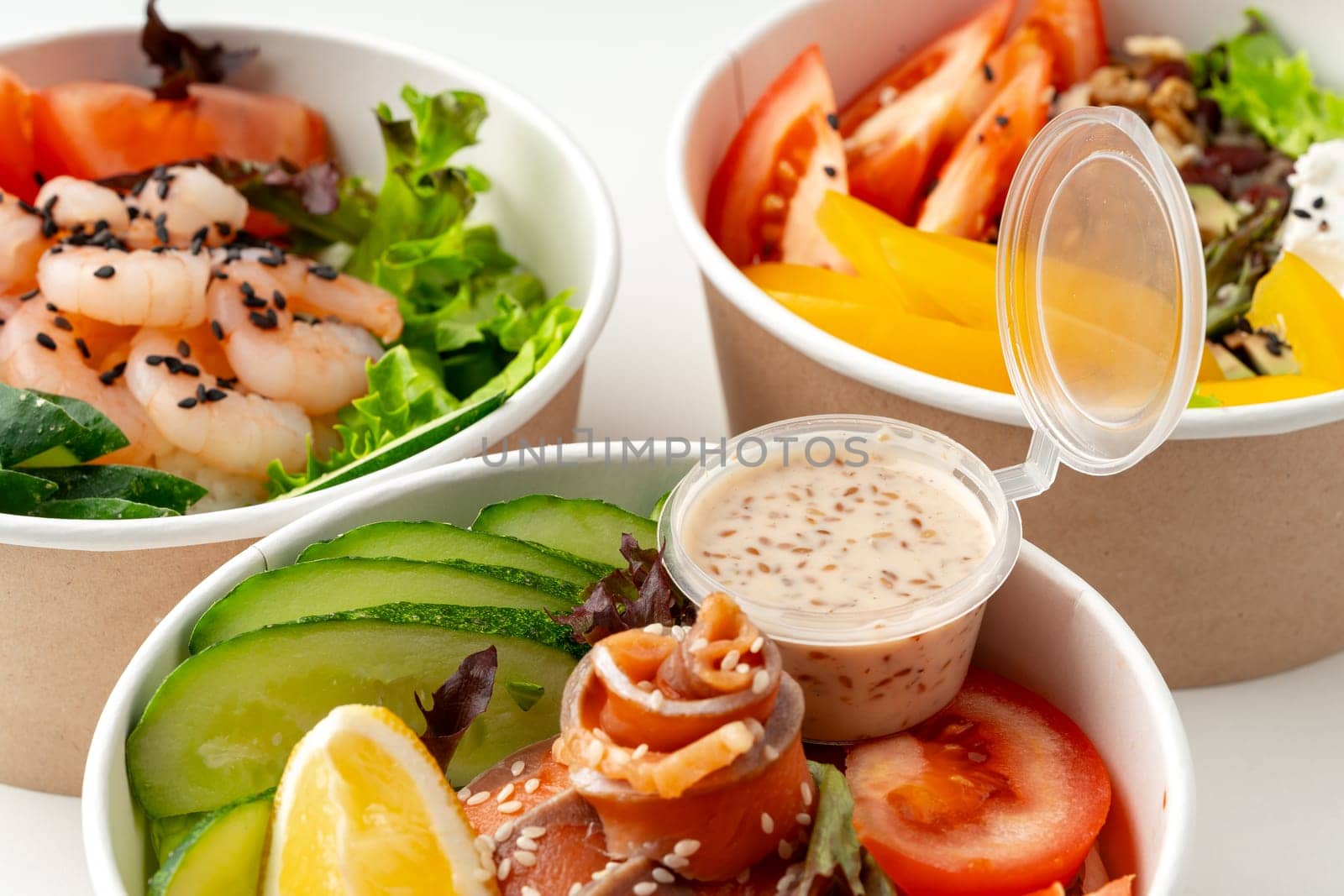 Tasty take out poke bowls isolated on white background close up