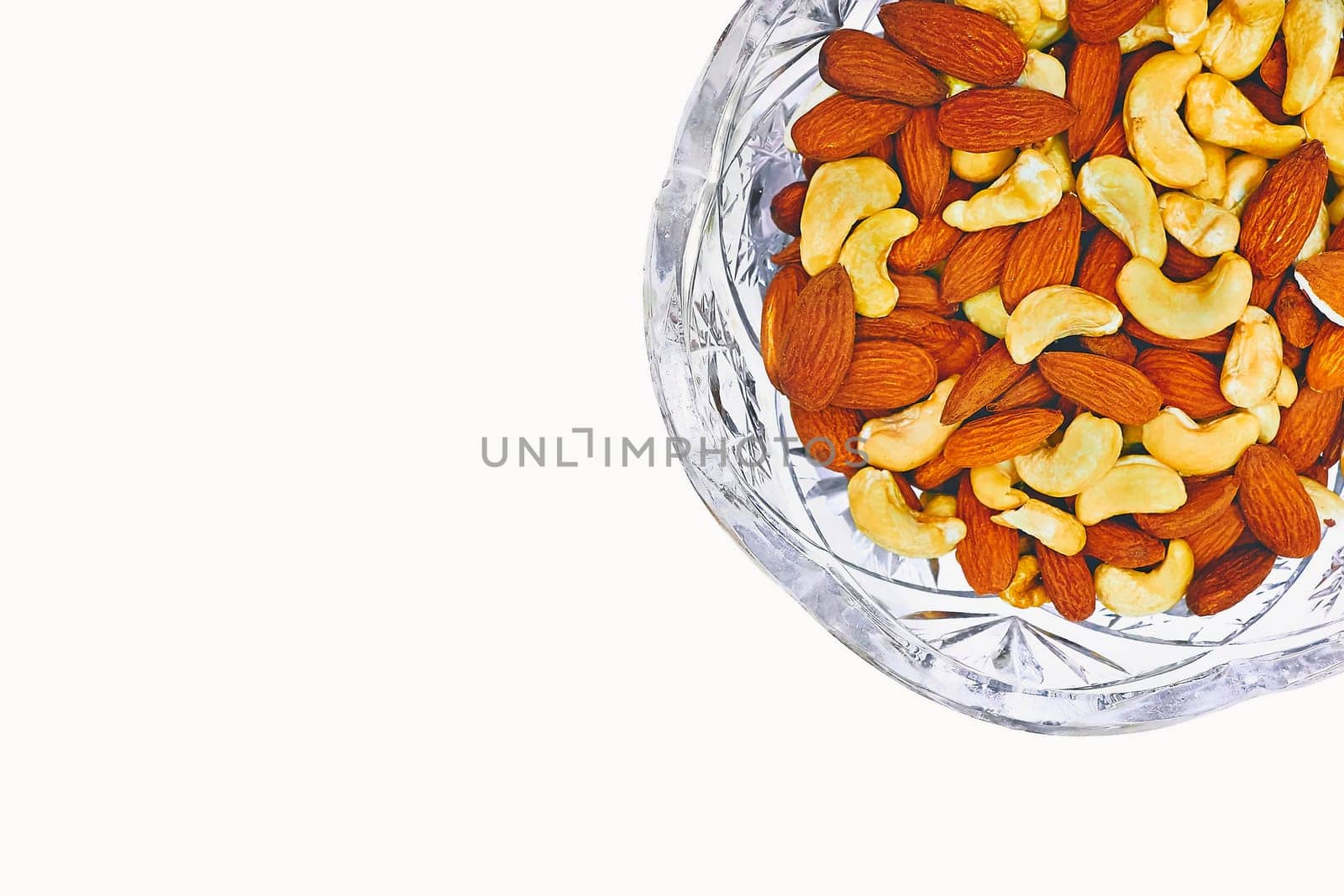 Crystal vase bowl with healthy nutritious nuts almond, cashew by jovani68