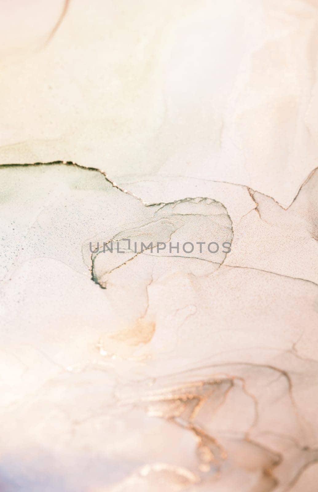 A close-up photograph of an abstract art piece featuring a swirling mixture of peach, grey, and white paint. The colors blend together softly, creating a unique and delicate design.