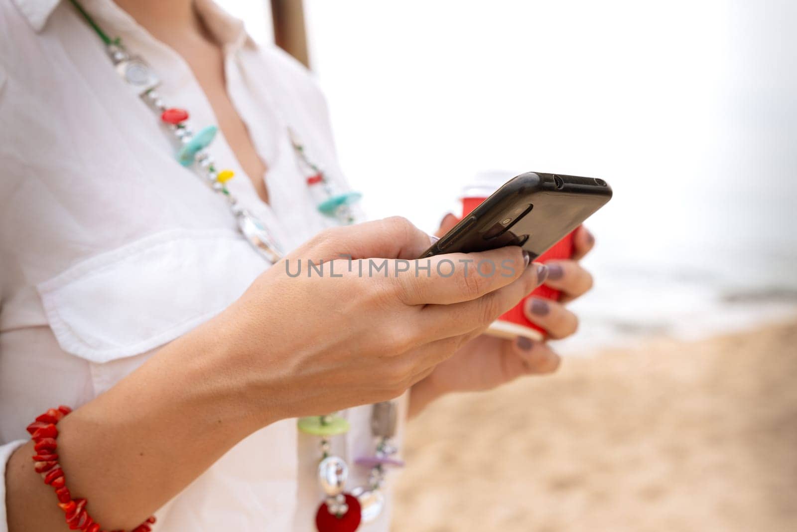 woman hands typing on phone browsing telephone on social media.