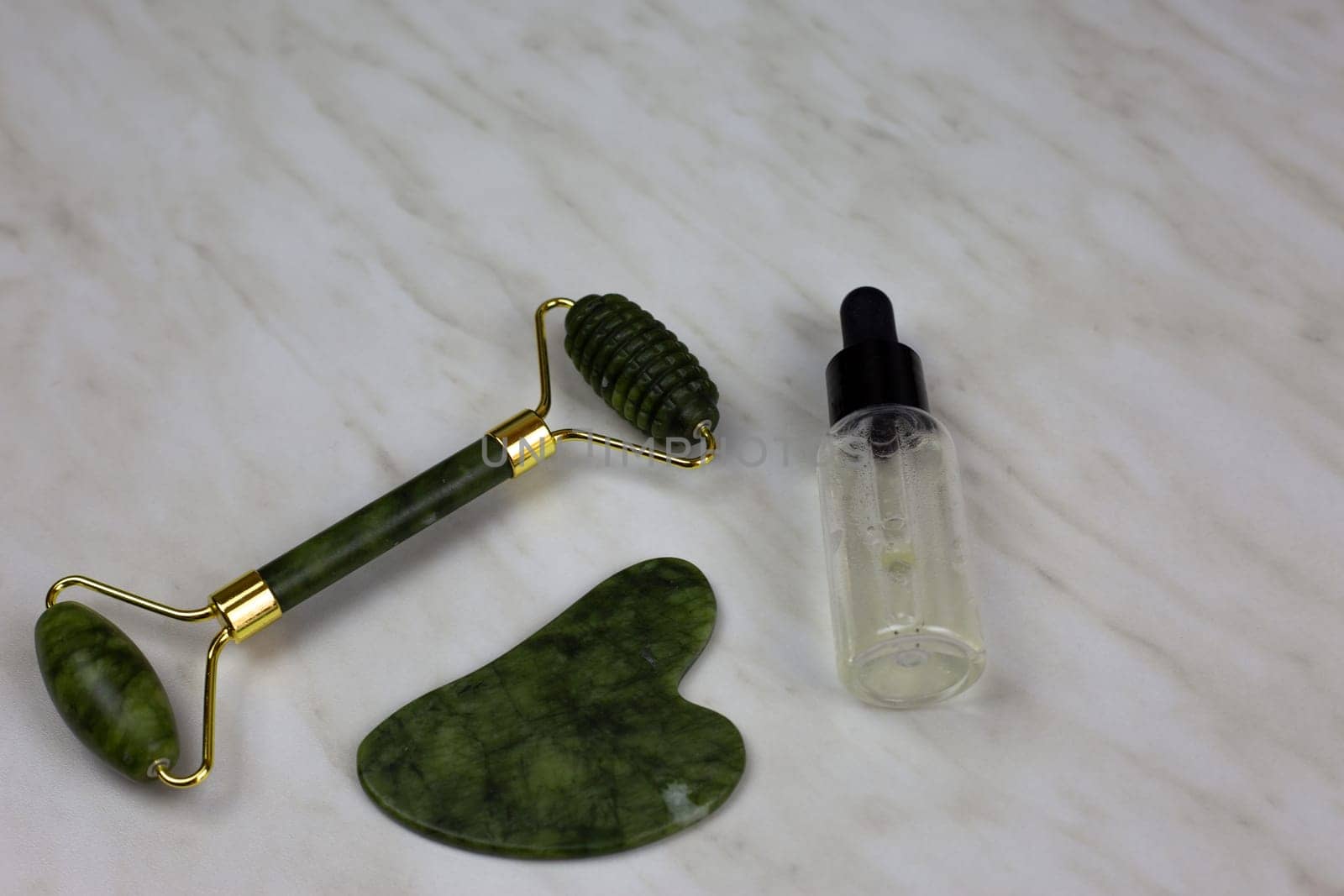 Skin care kit with gua sha scraper and roller with oil for body care by timurmalazoniia