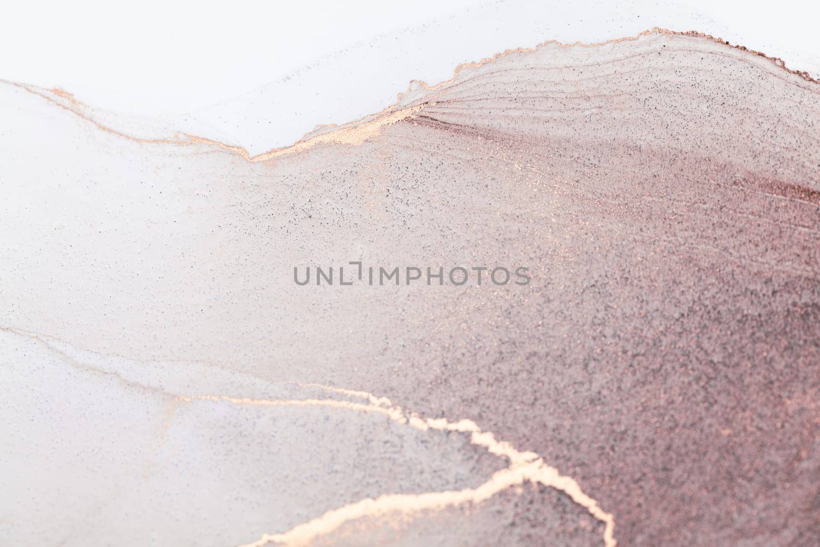 A close-up abstract image of a soft pink and white gradient background with thin, golden veins.