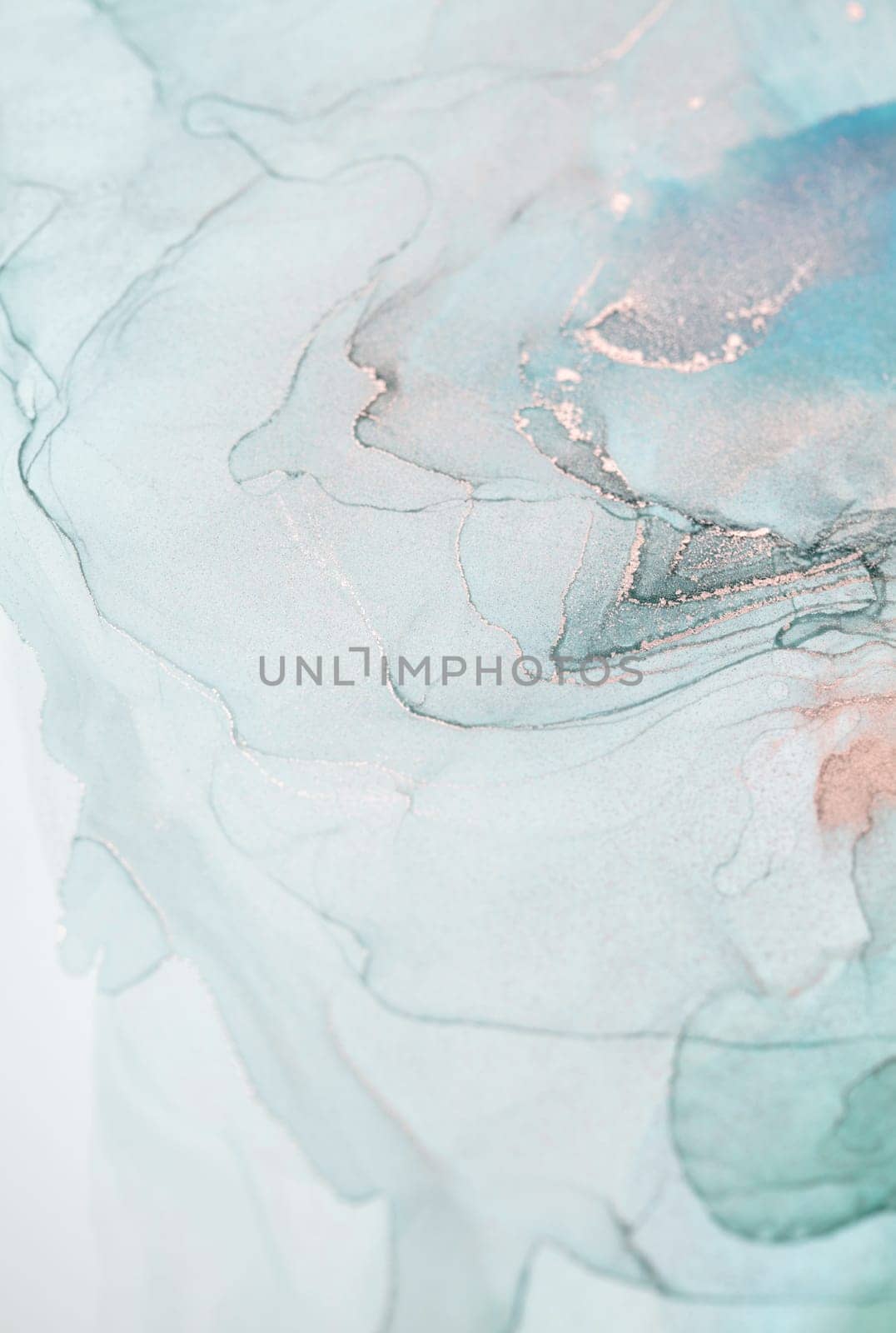 A close-up shot of an abstract painting created with teal and silver ink. The swirls and patterns create a mesmerizing and ethereal effect.