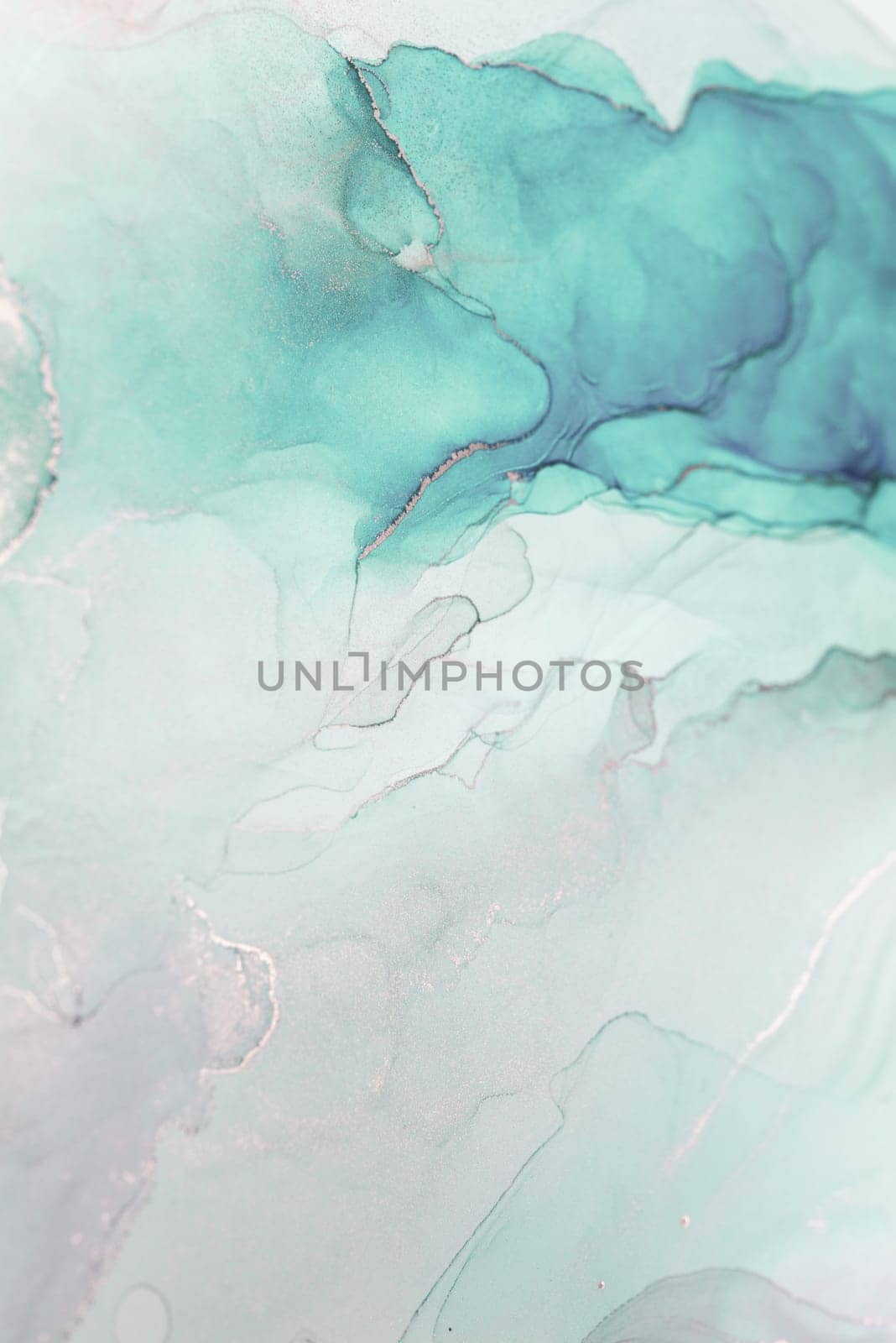 A close-up photograph of an abstract painting featuring swirling teal and silver colors. The image creates a sense of fluidity and movement.