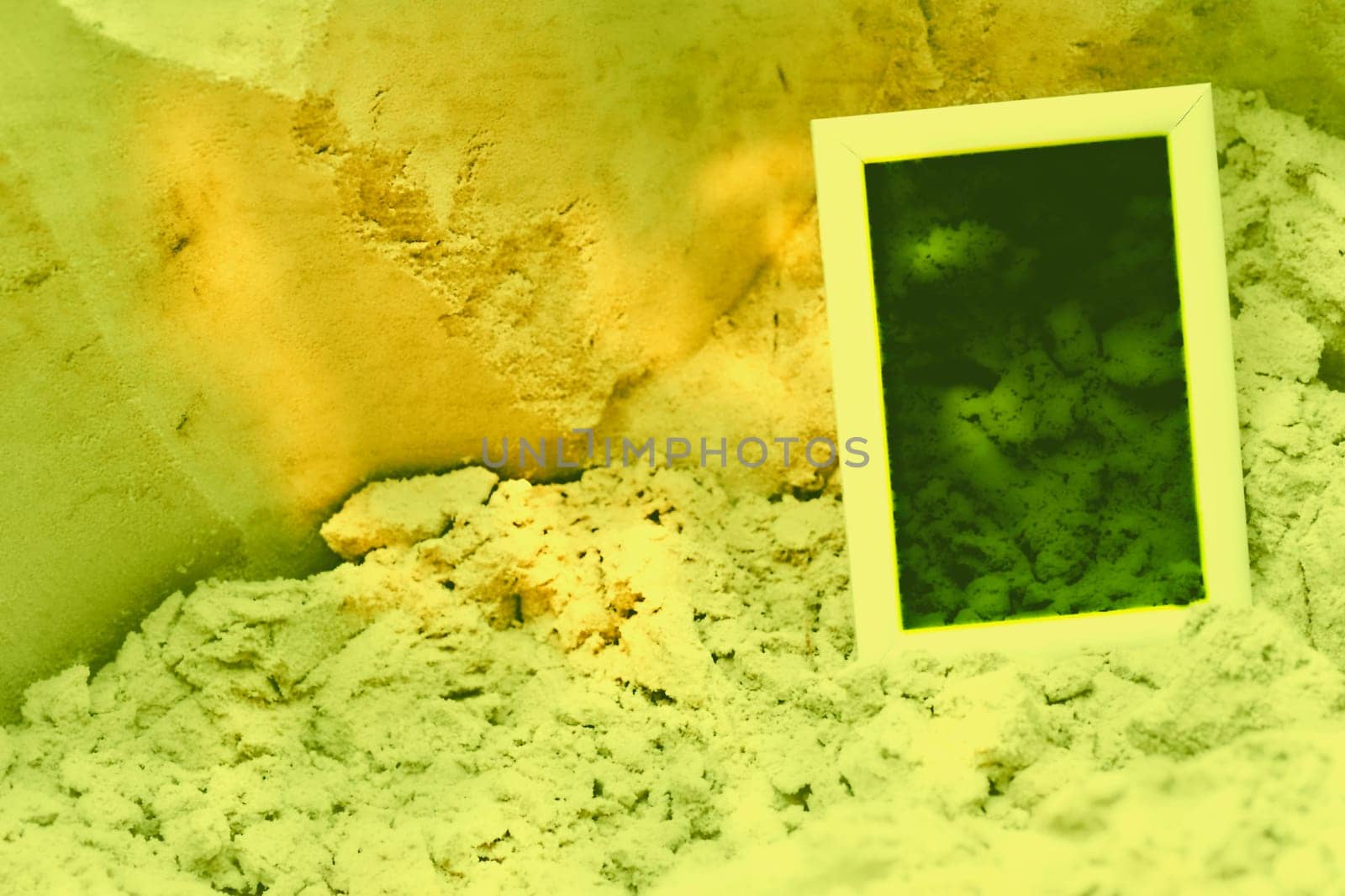 Pale frame with place for text on yellow green sand background by jovani68