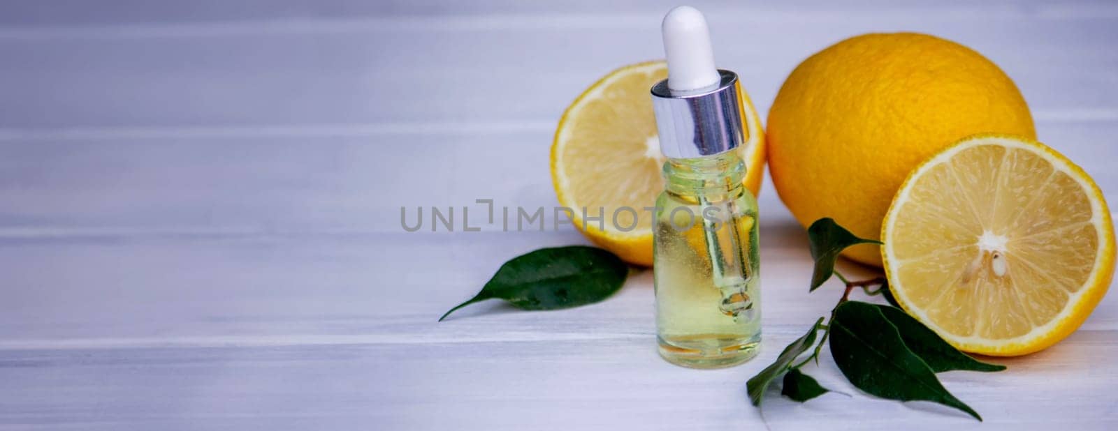 lemon oil in jars, fresh lemon. Selective focus. Nature