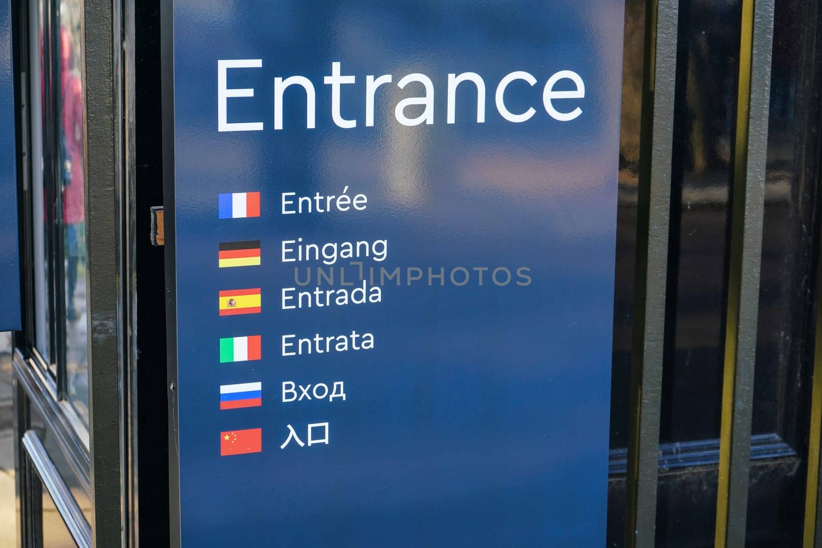 ENTRANCE label on blue board with different languages (french, german, spanish, italian, russian, chinese) translation