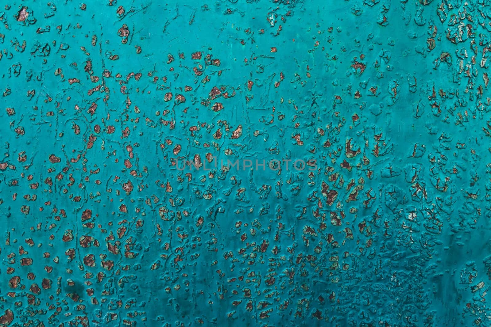 Metal texture covered with old blue paint with scratches and wear