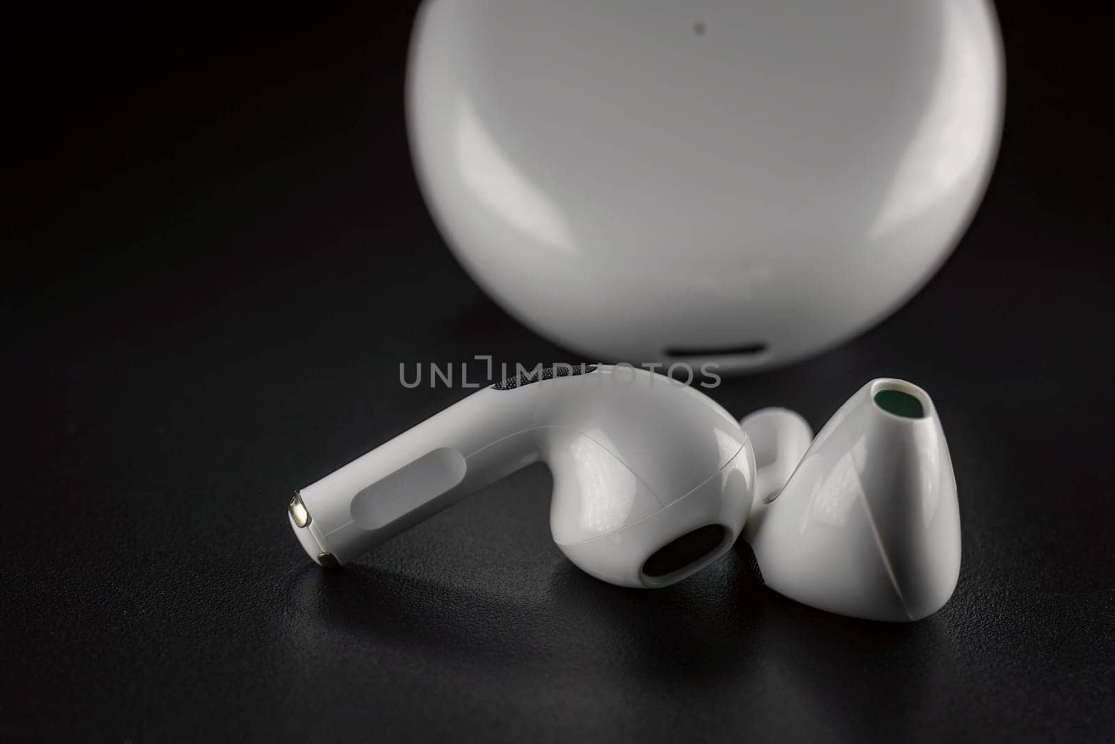 ROSTOV-ON-DON, RUSSIA - APRIL 28, 2018: Apple AirPods wireless Bluetooth headphones and charging case for Apple iPhone. New Apple Earpods Airpods in box.